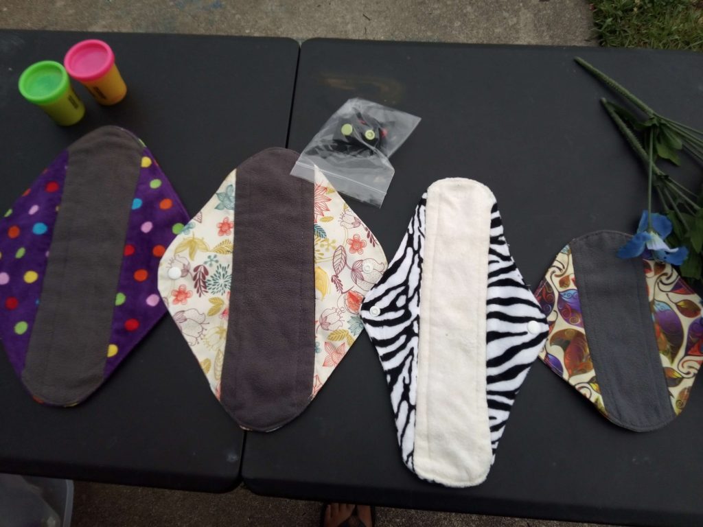 My assortment  of pads: from the ones for heaviest flow to the left to the ones for lightest flow to the right.