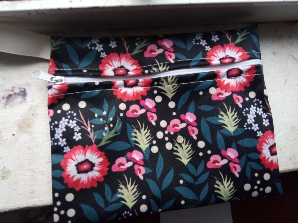 My colorful carrying pouch to store used and unused pads when out and about.